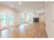 Bright living room with hardwood floors, fireplace, and access to a deck at 134 Henley St, Canton, GA 30114