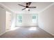 Spacious bedroom with carpeted floors and ceiling fan at 134 Henley St, Canton, GA 30114