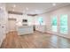 Bright kitchen with white cabinets, quartz countertops, and stainless steel appliances at 134 Henley St, Canton, GA 30114