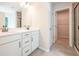 Bathroom with double vanity, large mirror, and walk-in shower at 134 Henley St, Canton, GA 30114