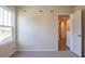Bedroom with large window, carpet flooring, and access to hallway at 134 Henley St, Canton, GA 30114