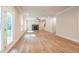 Spacious living room featuring hardwood floors, fireplace, and access to a deck at 134 Henley St, Canton, GA 30114