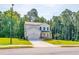 Two-story house with white siding, stone accents, and a two-car garage at 134 Henley St, Canton, GA 30114