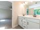 Double vanity bathroom with access to bedroom and linen closet at 134 Henley St, Canton, GA 30114