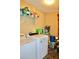 Laundry room with washer, dryer, and shelving for storage at 415 Chippenham Ct, Alpharetta, GA 30005
