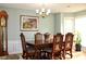 Formal dining room features hardwood floors and a chandelier at 415 Chippenham Ct, Alpharetta, GA 30005