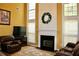 Spacious Gathering room with a fireplace and lots of natural light at 415 Chippenham Ct, Alpharetta, GA 30005