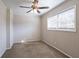 Spacious bedroom with ceiling fan and large window at 6230 Kensington Ct, Austell, GA 30106