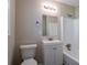 Clean bathroom with vanity, toilet, and shower/tub combo at 6230 Kensington Ct, Austell, GA 30106