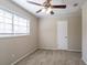 Bright bedroom with ceiling fan, neutral walls and carpet flooring at 6230 Kensington Ct, Austell, GA 30106