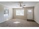 Spacious living room with neutral carpeting and ceiling fan at 6230 Kensington Ct, Austell, GA 30106