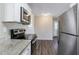 Updated kitchen with stainless steel appliances and granite countertops at 6230 Kensington Ct, Austell, GA 30106