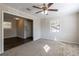 Bright living room featuring a ceiling fan and hardwood floors at 6230 Kensington Ct, Austell, GA 30106