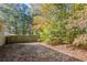 Wooded backyard with a wooden privacy fence at 6230 Kensington Ct, Austell, GA 30106