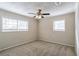 Spacious bedroom featuring ceiling fan, neutral walls and carpet flooring at 6230 Kensington Ct, Austell, GA 30106