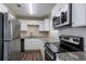 Modern kitchen featuring stainless steel appliances and granite countertops at 6230 Kensington Ct, Austell, GA 30106