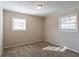 Bright bedroom with neutral walls, carpet flooring, and multiple windows at 6230 Kensington Ct, Austell, GA 30106
