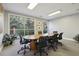 Bright meeting room with a large conference table and comfortable chairs at 10 Perimeter Summit Ne Blvd # 4435, Brookhaven, GA 30319