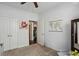 Bright bedroom with ceiling fan, carpet flooring, and access to the hallway at 10 Perimeter Summit Ne Blvd # 4435, Brookhaven, GA 30319