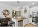 Updated kitchen with granite countertops, stainless steel appliances, and breakfast bar at 10 Perimeter Summit Ne Blvd # 4435, Brookhaven, GA 30319