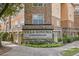 Villa Sonoma Condominiums building entrance with landscaping and signage at 10 Perimeter Summit Ne Blvd # 4435, Brookhaven, GA 30319