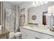 Clean bathroom with tub shower combo, granite vanity, and updated fixtures at 10 Perimeter Summit Ne Blvd # 4435, Brookhaven, GA 30319