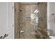 Spacious shower with glass enclosure, built-in seat, and tiled walls at 10 Perimeter Summit Ne Blvd # 4435, Brookhaven, GA 30319