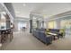 Spacious community room featuring a large sectional sofa and tables at 10 Perimeter Summit Ne Blvd # 4435, Brookhaven, GA 30319