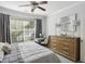 Bright bedroom with large window, dresser, and comfortable bed at 10 Perimeter Summit Ne Blvd # 4435, Brookhaven, GA 30319