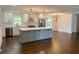Modern kitchen with gray island and hardwood floors at 2534 Creekview Sw Dr, Marietta, GA 30008