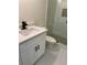 Bathroom with white vanity, quartz countertop, and updated toilet at 2534 Creekview Sw Dr, Marietta, GA 30008