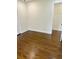 Bright bedroom with dark hardwood floors and access to hallway at 2534 Creekview Sw Dr, Marietta, GA 30008