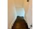 Dark hardwood staircase leading to the next floor at 2534 Creekview Sw Dr, Marietta, GA 30008