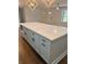 Large kitchen island with white quartz countertop and gray cabinets at 2534 Creekview Sw Dr, Marietta, GA 30008