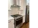 Stainless steel range and oven with white shaker cabinets at 2534 Creekview Sw Dr, Marietta, GA 30008