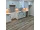 Newly renovated basement kitchen with white shaker cabinets and gray tile backsplash at 2534 Creekview Sw Dr, Marietta, GA 30008