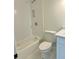 Basement bathroom with white vanity, subway tile shower, and a white toilet at 2534 Creekview Sw Dr, Marietta, GA 30008