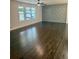 Hardwood floors and an accent wall in this open living area at 2534 Creekview Sw Dr, Marietta, GA 30008