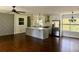 Open living room with hardwood floors and an accent wall at 2534 Creekview Sw Dr, Marietta, GA 30008