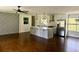 Spacious living room featuring hardwood floors and a stylish accent wall at 2534 Creekview Sw Dr, Marietta, GA 30008