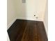 Empty laundry room with dark hardwood floors and hookups for washer and dryer at 2534 Creekview Sw Dr, Marietta, GA 30008