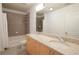 Bathroom with double sinks, granite countertop, and tub at 400 W Peachtree Nw St # 1713, Atlanta, GA 30308
