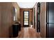 Modern entryway with wood wall paneling and hardwood floors at 1281 Avalon Ne Pl, Atlanta, GA 30306