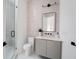 Spa-like bathroom with a frameless shower, floating vanity and light grey tile at 1281 Avalon Ne Pl, Atlanta, GA 30306