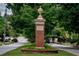 Morningside Lenox Park neighborhood entrance with brick column and ornate details at 1281 Avalon Ne Pl, Atlanta, GA 30306