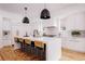 Modern kitchen with white cabinets, quartz countertops, and an island at 1281 Avalon Ne Pl, Atlanta, GA 30306