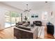 Bright living room featuring hardwood floors and sliding glass doors opening to backyard at 1281 Avalon Ne Pl, Atlanta, GA 30306