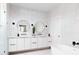 Modern bathroom with double vanity and a soaking tub at 1281 Avalon Ne Pl, Atlanta, GA 30306