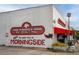 The Gathering Dog restaurant in Morningside, with a dog logo and signage at 1281 Avalon Ne Pl, Atlanta, GA 30306