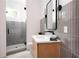 Bathroom with gray tile, a floating vanity, and a walk-in shower at 1281 Avalon Ne Pl, Atlanta, GA 30306